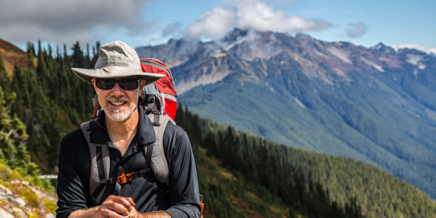 Travel heart health benefits hiking retiree 710x450
